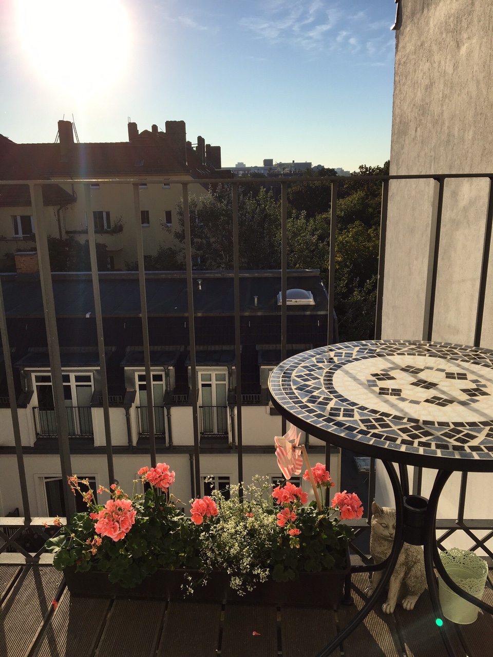Balcony with Italian mosaic table. Our gorgeous "Altbau" flat is located in Berlin's trendy Prenzlauer Berg.